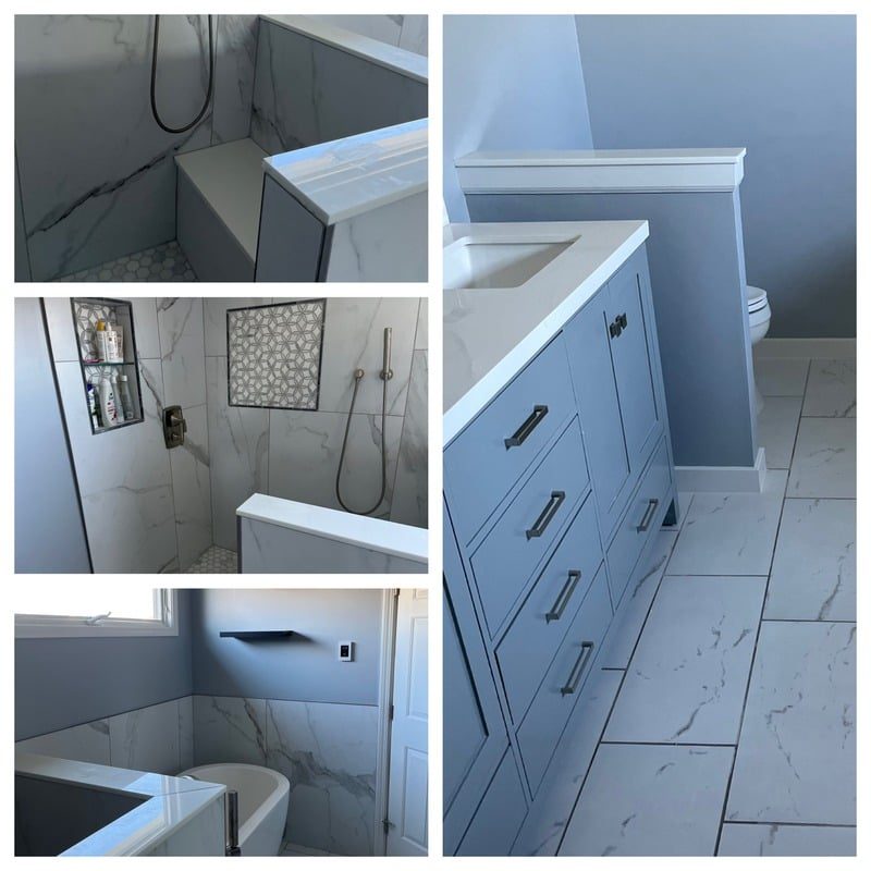 Bathroom after remodel, with new tile and white vanity