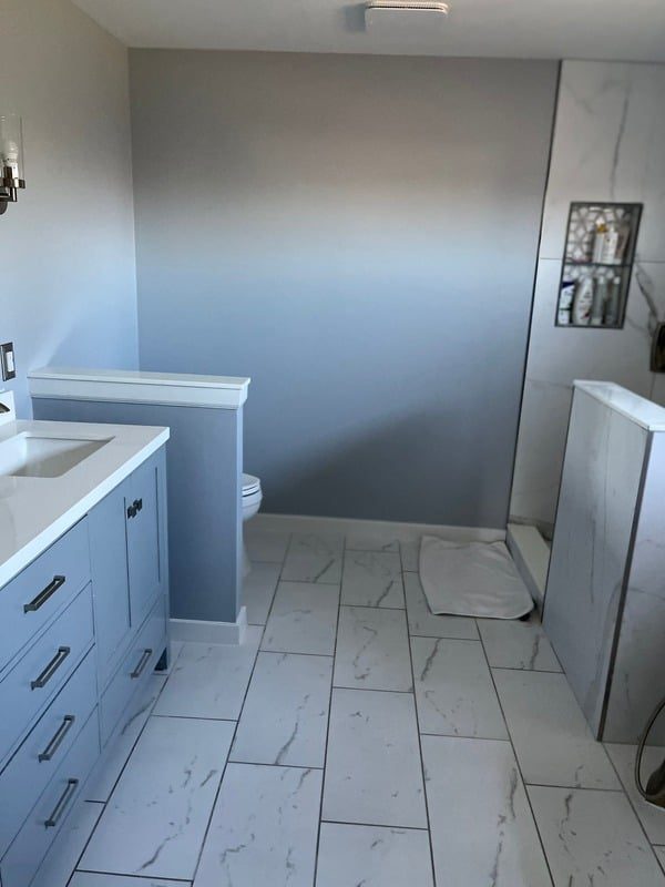 Commercial bathroom tile installation in progress