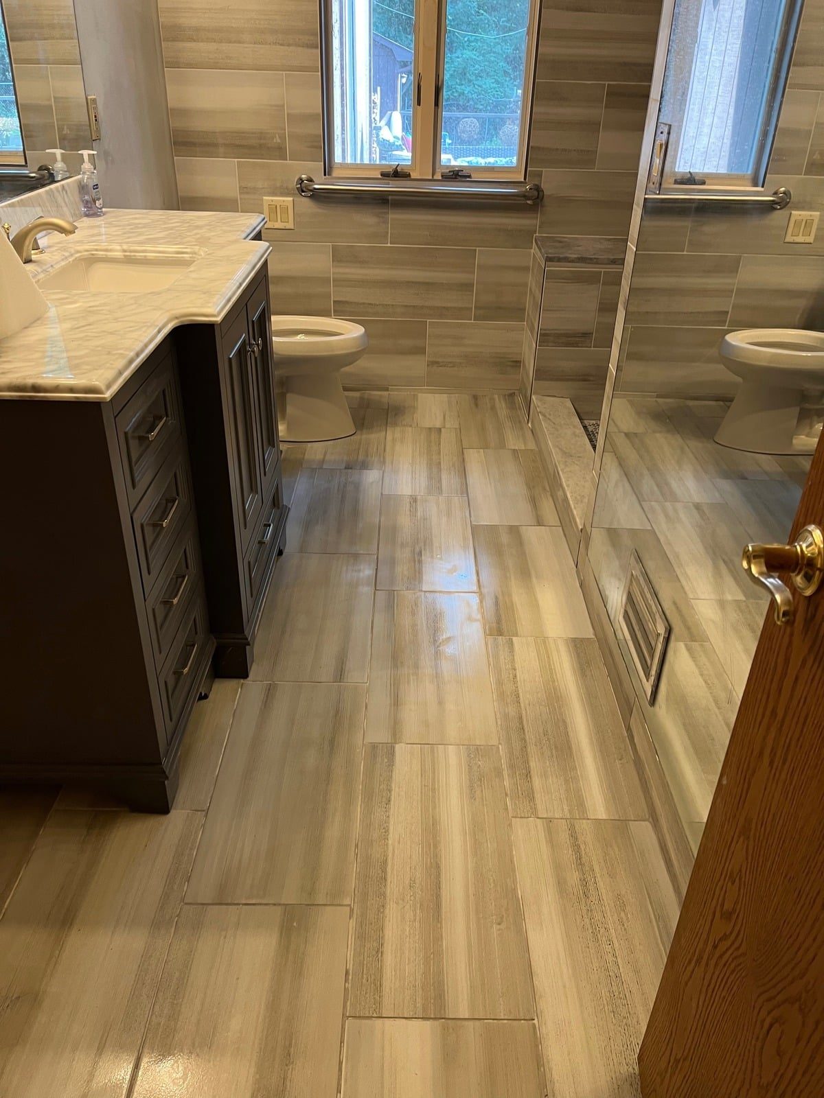 Wood-look plank tile flooring in a hallway